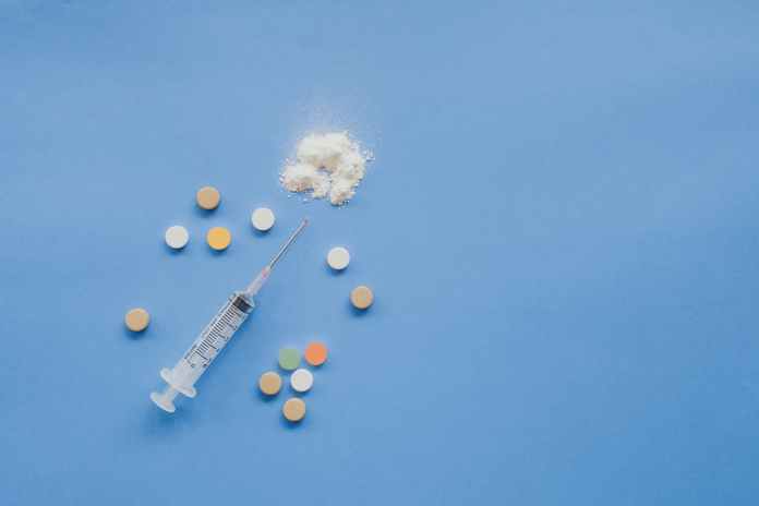 top view of syringe with pills