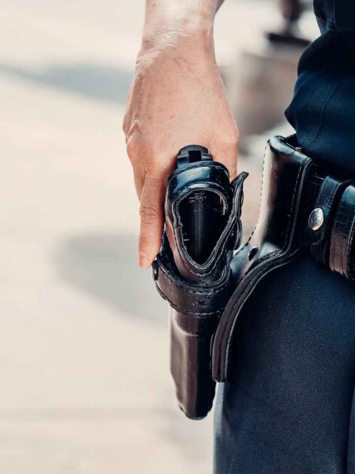 person holding a handgun