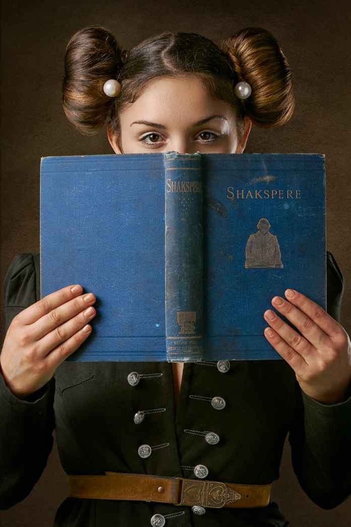 woman in historic costume with poetry book
