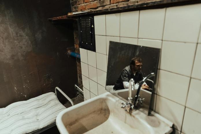 reflection of a man in jail